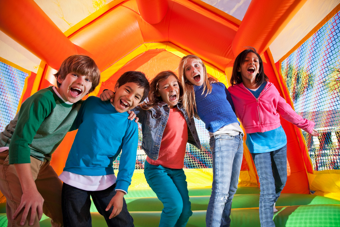 Group of excited children in bouncy house